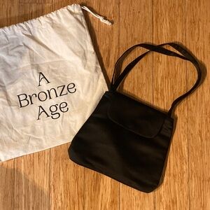 A Bronze Age satin purse